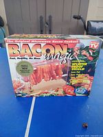 Front of boxed Bacon Magic microwave bacon cooker