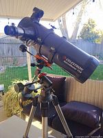 Overall view of Celestron AstroMaster 114 telescope on tripod