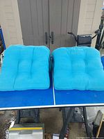 Two cushions side by side showing color and tufting