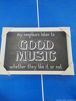 Front view of framed quote sign showing full text and frame detail