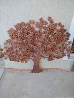 Front view of metal tree wall art