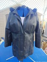 Front view showing overall style, length and front zipper