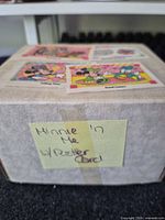 Closed box with four sample Minnie 'n Me cards on lid