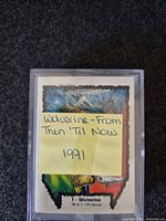 Front of card stack showing title card inside plastic case