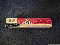 Cardboard sleeve showing Hero branding and model M1009