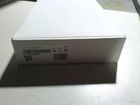 Plain white sealed box containing the ADT touchscreen keypad, barcode label visible