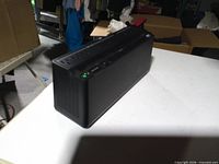 Front angled view of APC Back-UPS showing housing and LED indicator