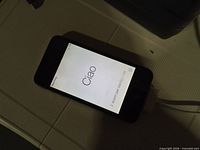 Front of powered-on iPhone 4 showing setup screen