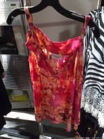 Front view of Avenue floral sleeveless top on hanger