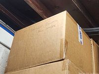 Overall view of sealed box with handwritten label