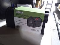 Front view of boxed Postal Pro The Ambrose mailbox showing product label and image