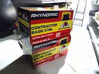 Stacked view of two sealed Rhynopac contractor bag boxes showing specifications