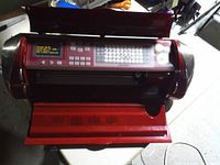 Full view of Cricut Cake machine with lid open showing carriage and keypad