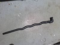 Full view of black wavy cane with dragon head handle