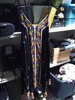 Full view of dress hanging, showing length and straps