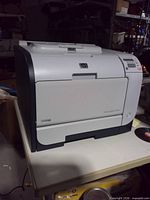 Front view of HP Color LaserJet CP2025 printer