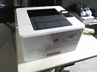 Front and top view of HP LaserJet Pro M402n printer showing overall condition