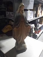 Front view of Virgin Mary statue on table