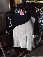 Front view showing color-block design and bead accent