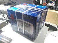 Sealed Midea EasyCool air conditioner box showing front panel with model details