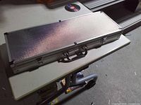 closed aluminum poker chip case with handle and latches