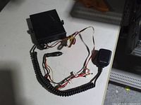 Top view of Realistic CB transceiver with attached harness and microphone