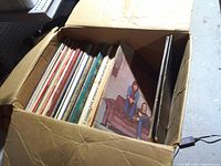 Overview of box filled with vinyl records