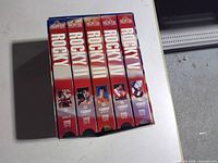 Front view of five VHS tapes in slipcase