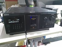 Front of Sony CD changer powered on showing display, controls and MegaStorage 400 door