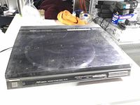 Closed dust cover showing overall unit surface wear and scuffs