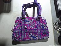 Front of Vera Bradley quilted paisley handbag