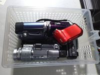 Five camcorders in plastic basket
