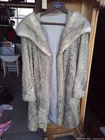 Full front view of Persian lamb coat on hanger