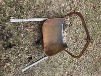 Full view of buck scraper showing pan, yoke, and handles