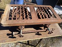 Full view of cast iron double burner on table