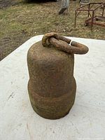 Front view of cast iron counterweight showing overall cylindrical form and ring