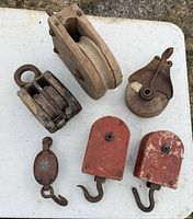 Group shot of six pulley blocks on table