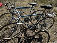 Two blue road bikes side by side