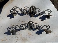 Front view of both matching metal wall candle sconces