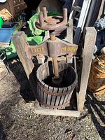 Front view of Eagle wooden wine press with basket and screw mechanism