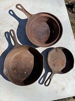 All three cast iron skillets nested together showing size comparison