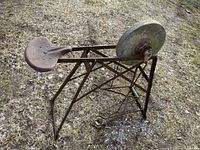 Overall view of grinding wheel with seat and frame