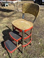 Front view showing seat, backrest, and deployed steps