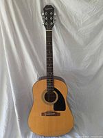 Full front view of Epiphone AJ-10 guitar showing body, neck, and overall condition