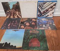 Group shot of all eight LP covers laid out on floor