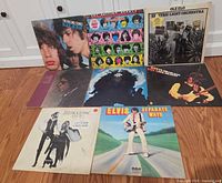 Eight LP jackets laid out on floor