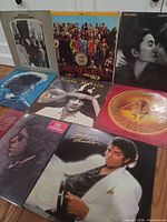 Group shot showing all eight album covers