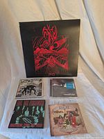 Group shot showing vinyl LP and four CDs