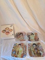 All four plates and retail box displayed