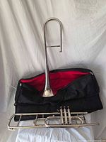 Valve trombone bell and valve sections displayed with open gig bag